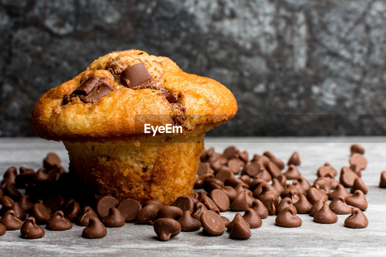 Close-up of muffin with chocolate chips on table