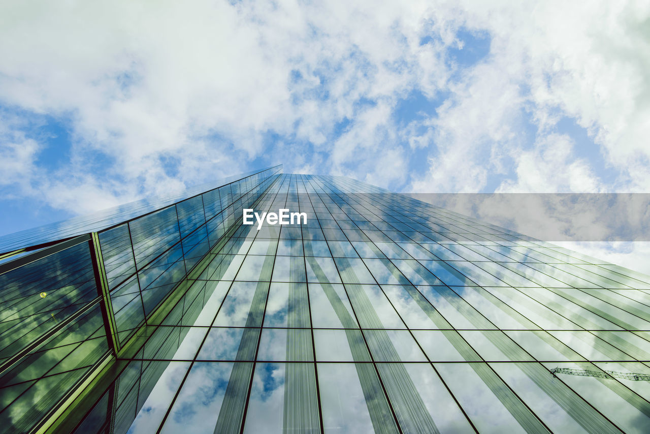 Low angle view of modern skyscraper against sky