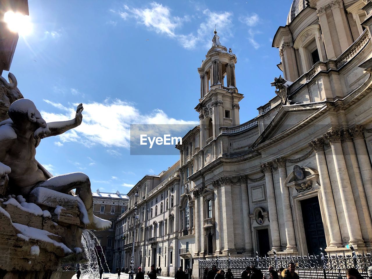 Low angle view of church against blue sky in city