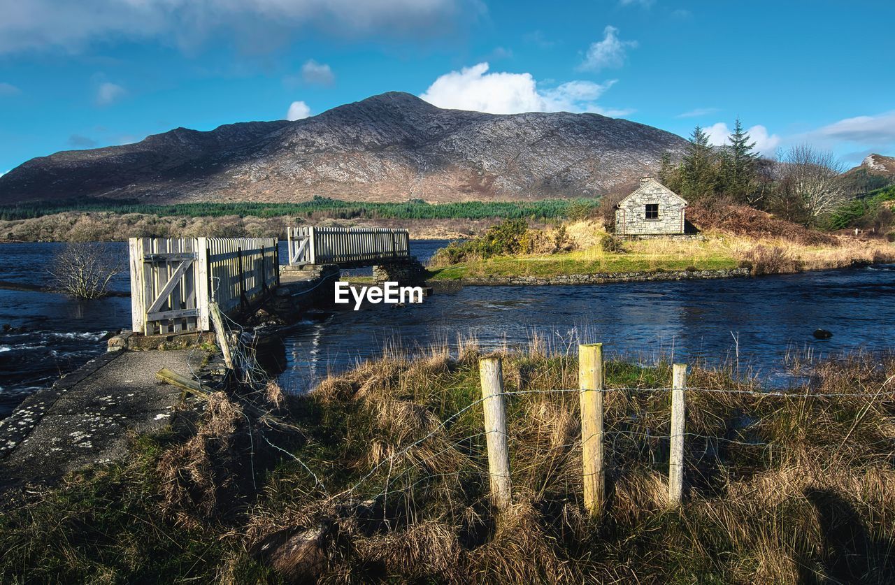 Dramatic landscape scenery, trail, river and mountains, derryclare, connemara, ireland