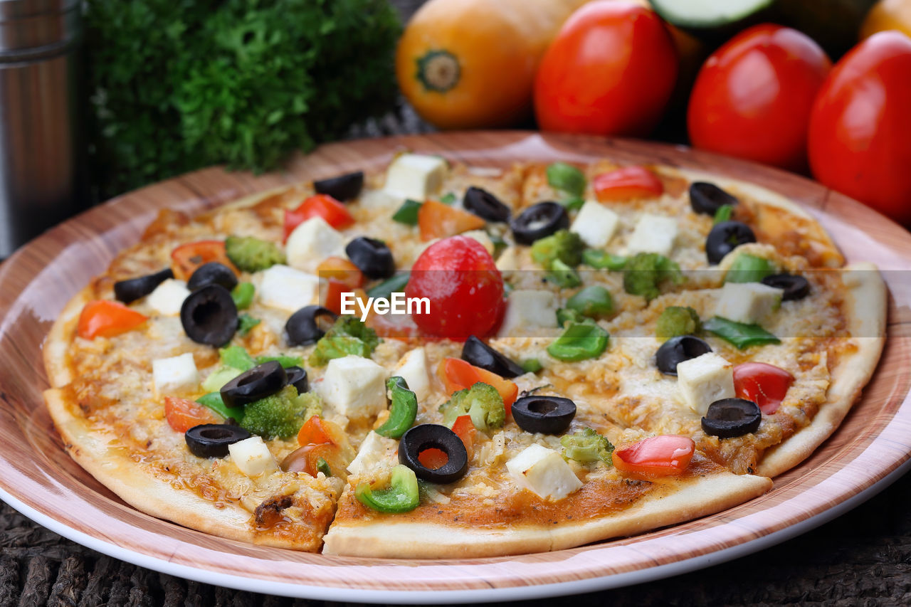 Close-up of pizza in plate on table