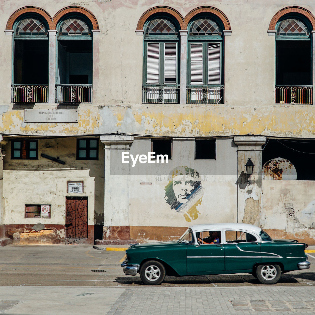 CAR ON STREET AGAINST BUILDINGS