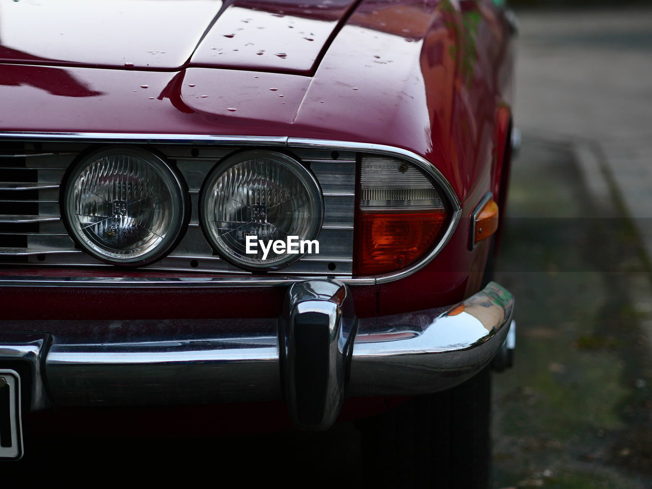 car, mode of transportation, vehicle, motor vehicle, transportation, land vehicle, headlight, luxury vehicle, automotive exterior, automobile, retro styled, sports car, red, bumper, metal, no people, executive car, vintage car, front view, focus on foreground, performance car