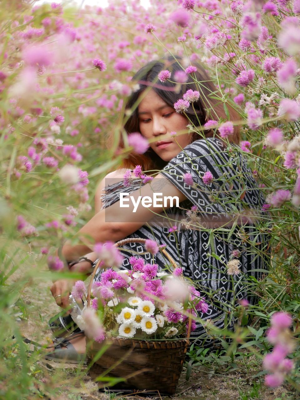 Beautiful woman with pink flower