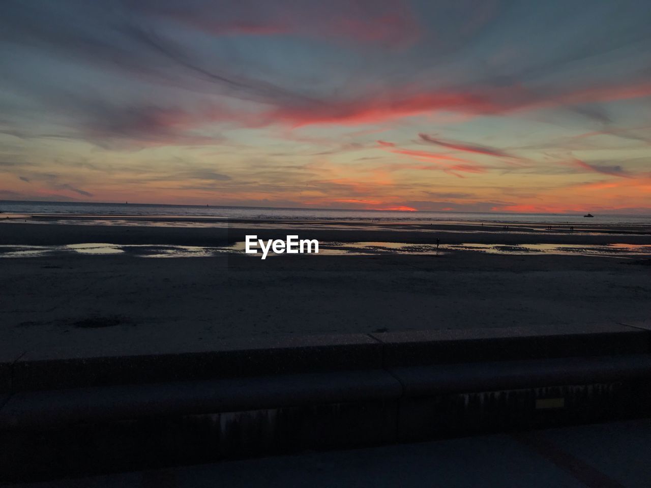 SCENIC VIEW OF SEA AGAINST ORANGE SKY