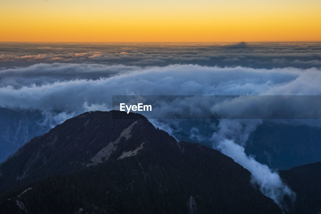 Scenic view of mountains against sky during sunset