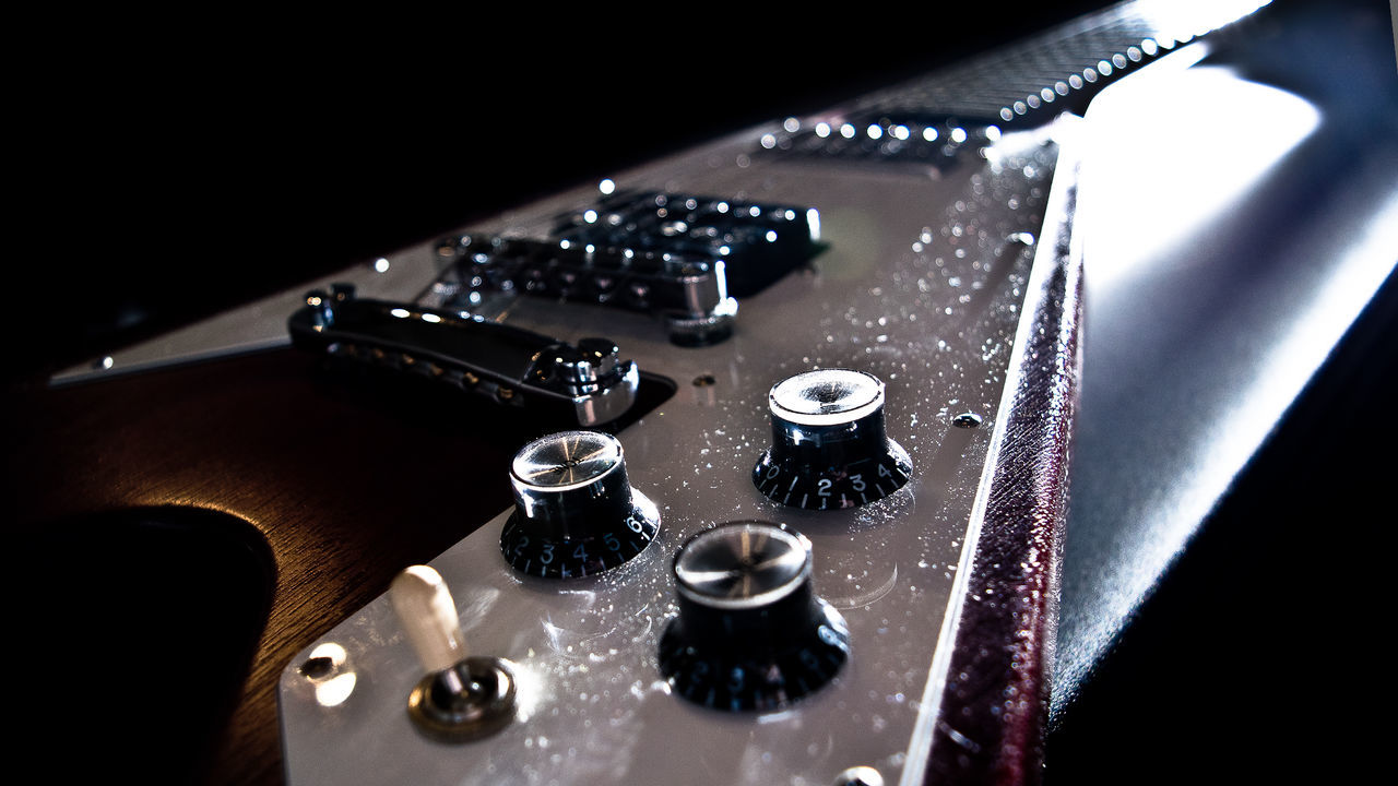 Close-up of electric guitar volume knobs