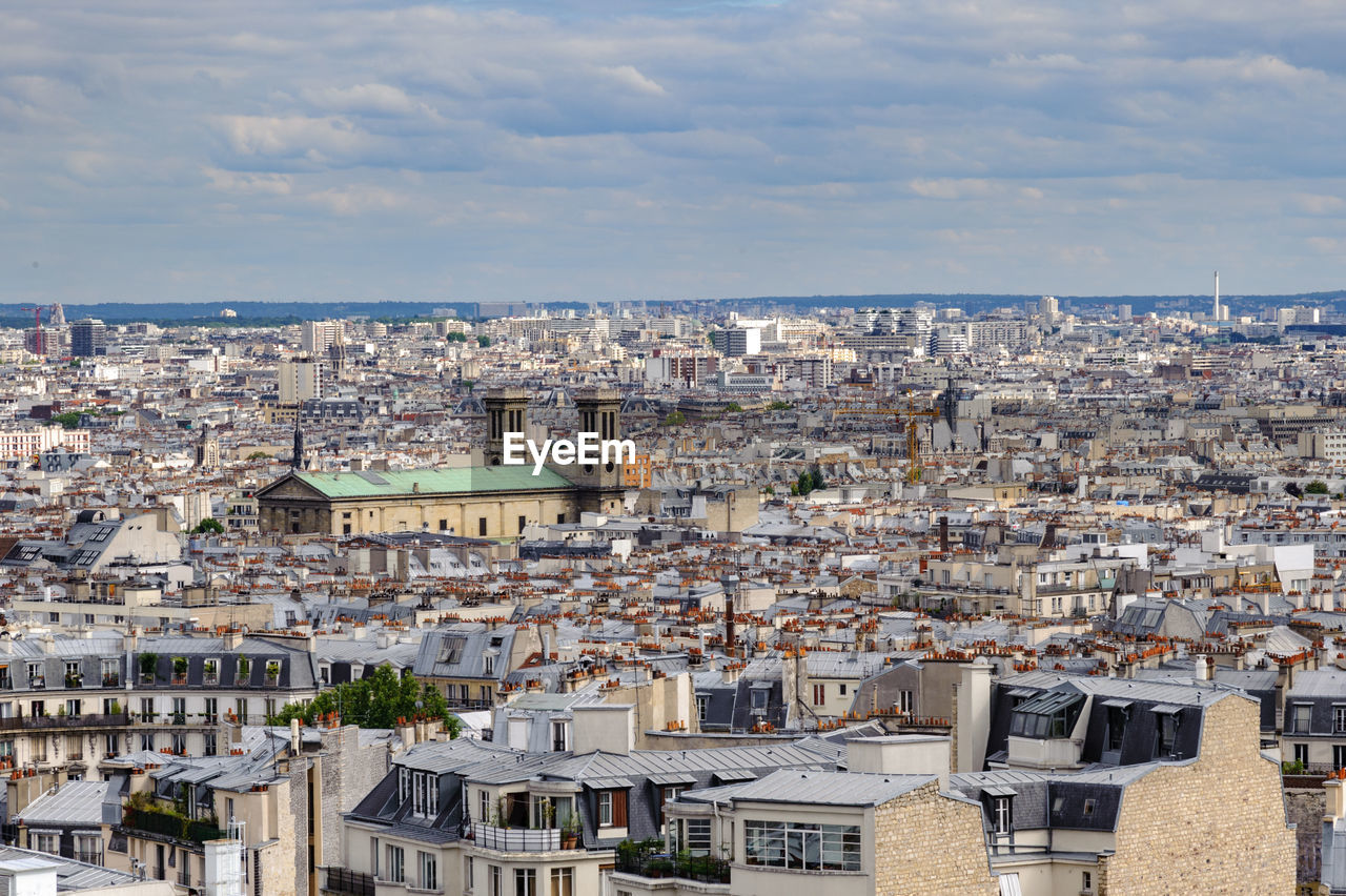 Aerial view of cityscape against sky