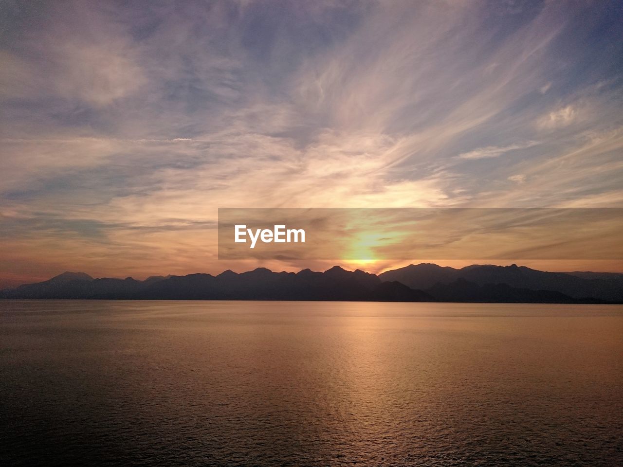 SCENIC VIEW OF LAKE DURING SUNSET