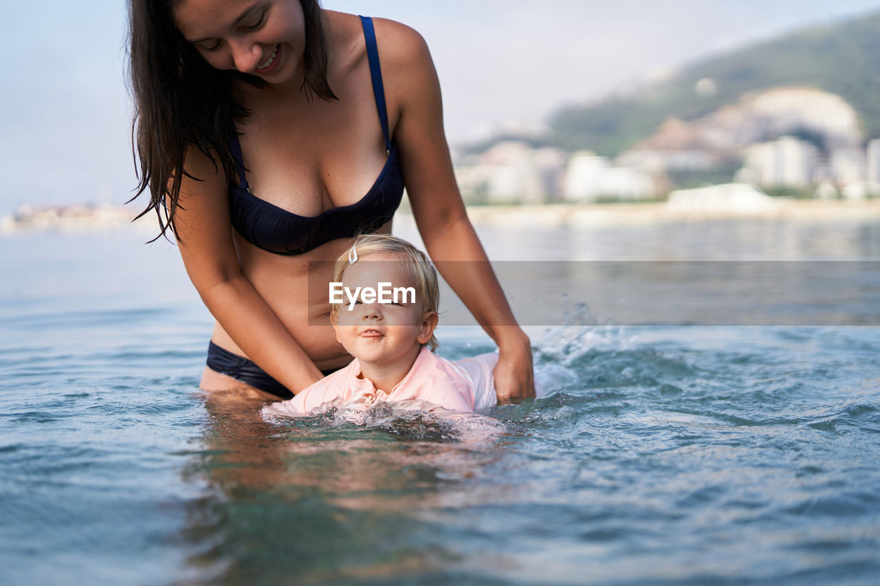 portrait of woman swimming in sea