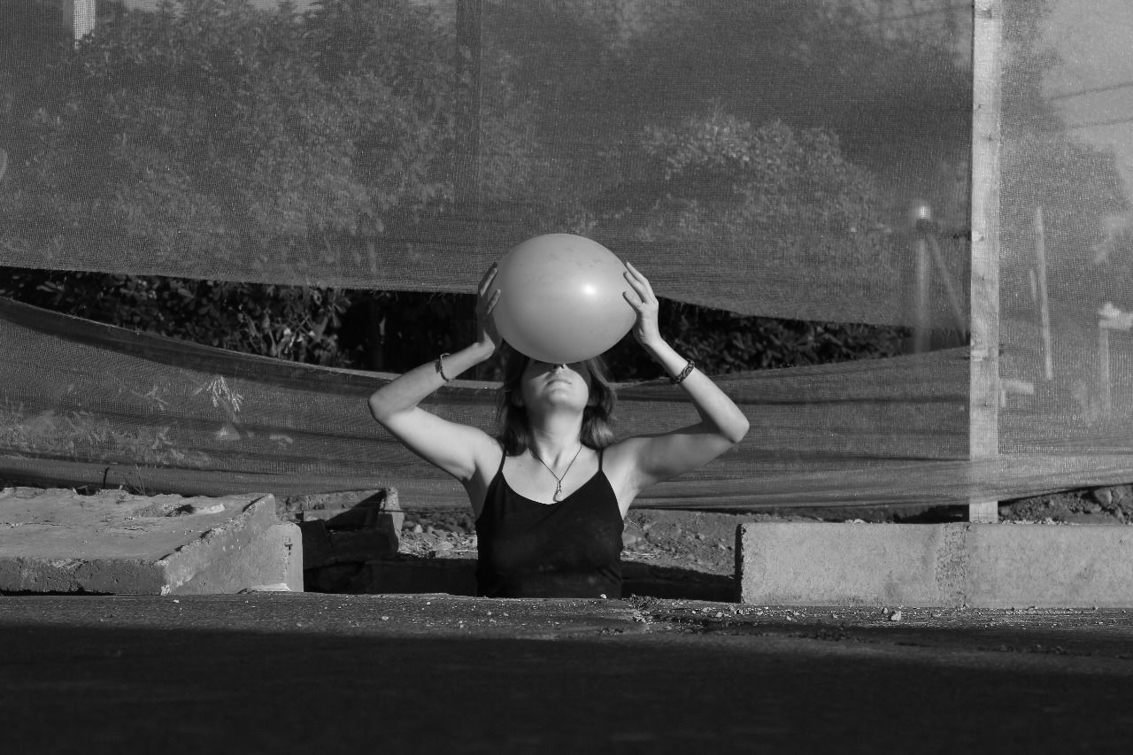 Young woman holding ball