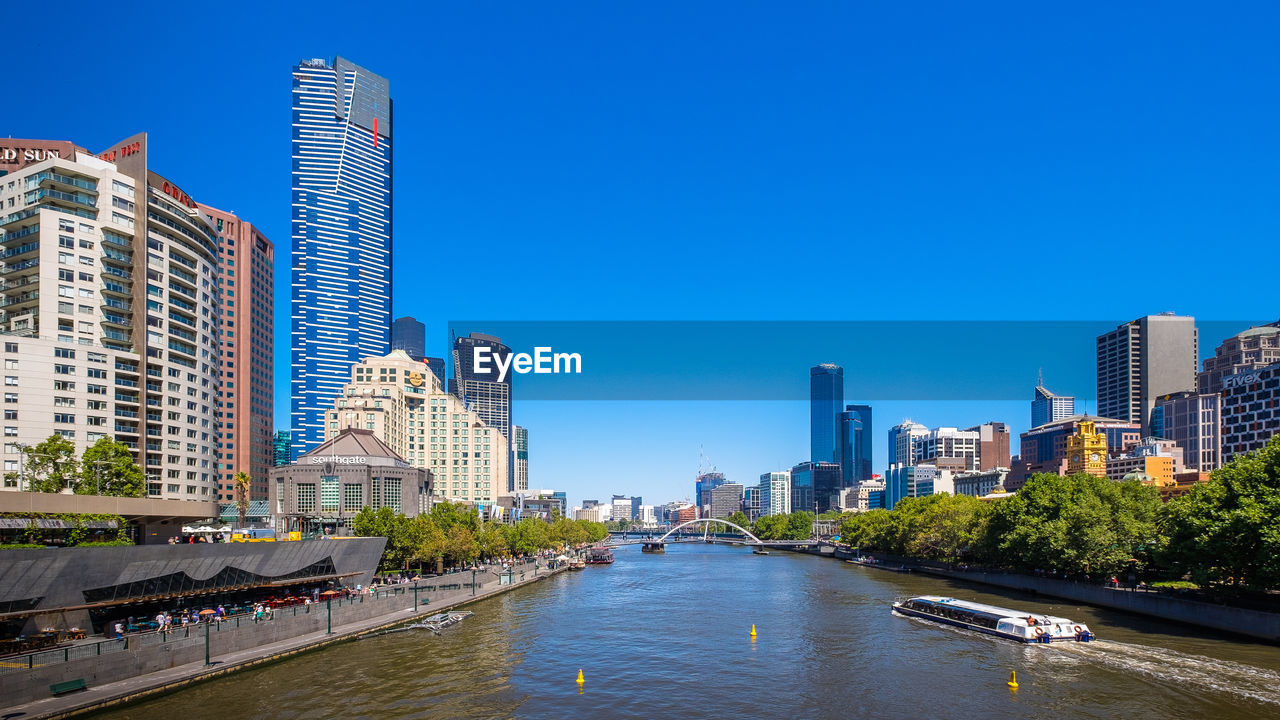 SKYSCRAPERS IN CITY AGAINST CLEAR SKY