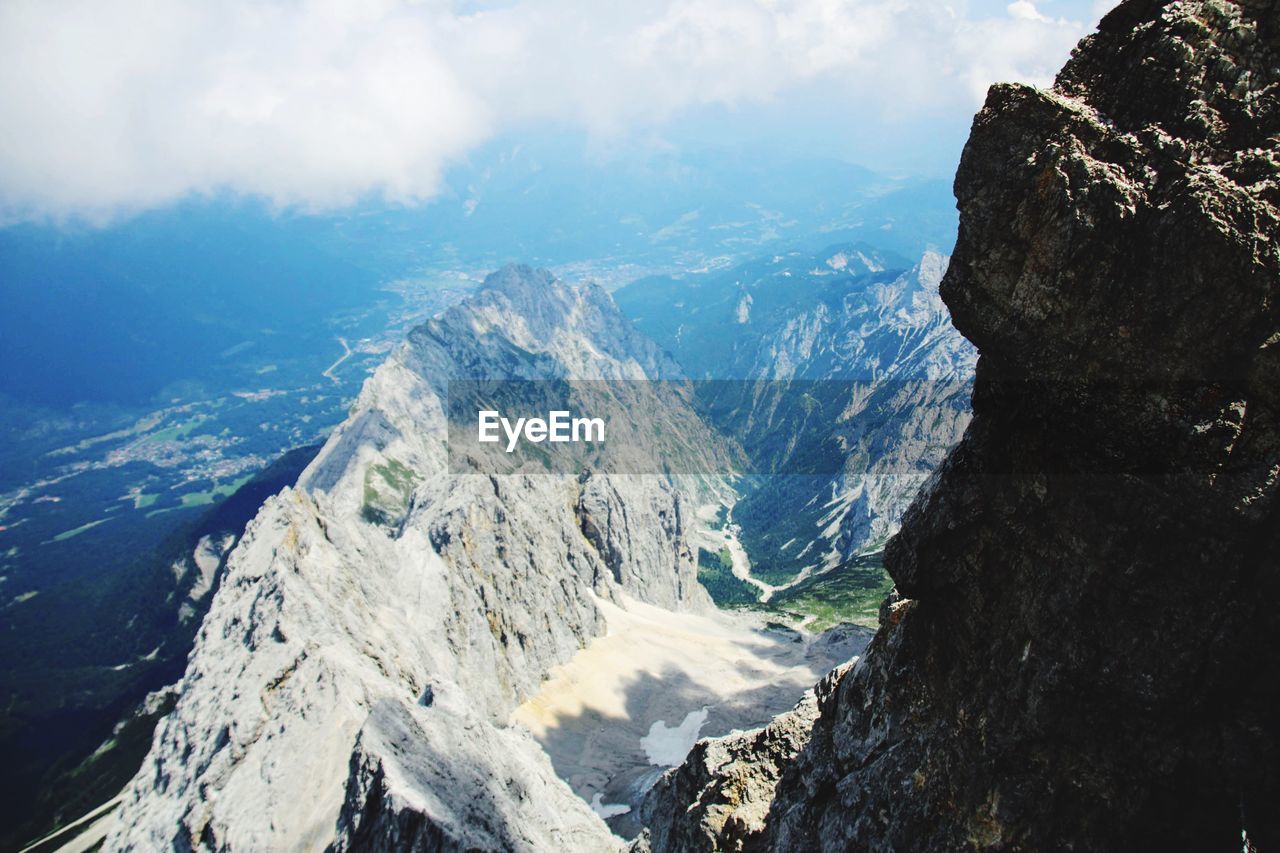 Panoramic view of snowcapped mountains against sky