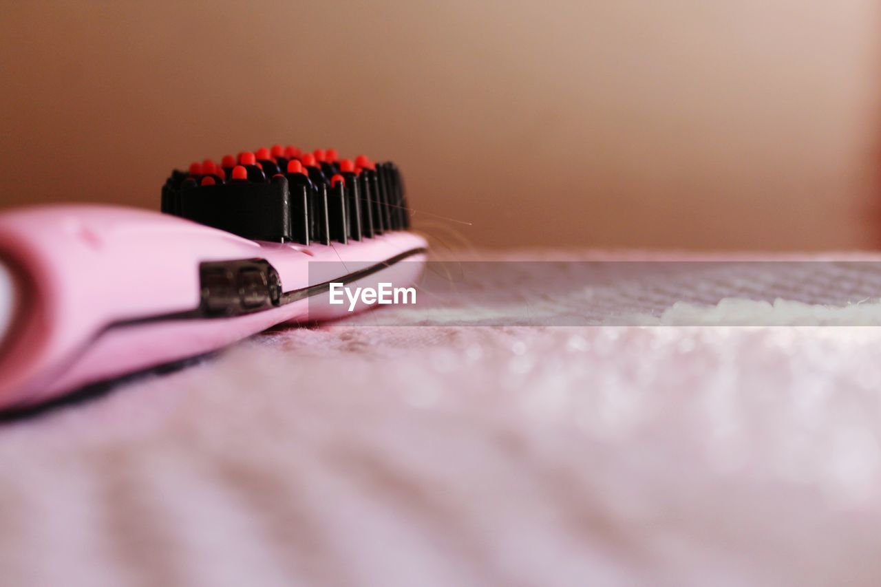 CLOSE-UP OF HUMAN HAND ON BLACK TABLE