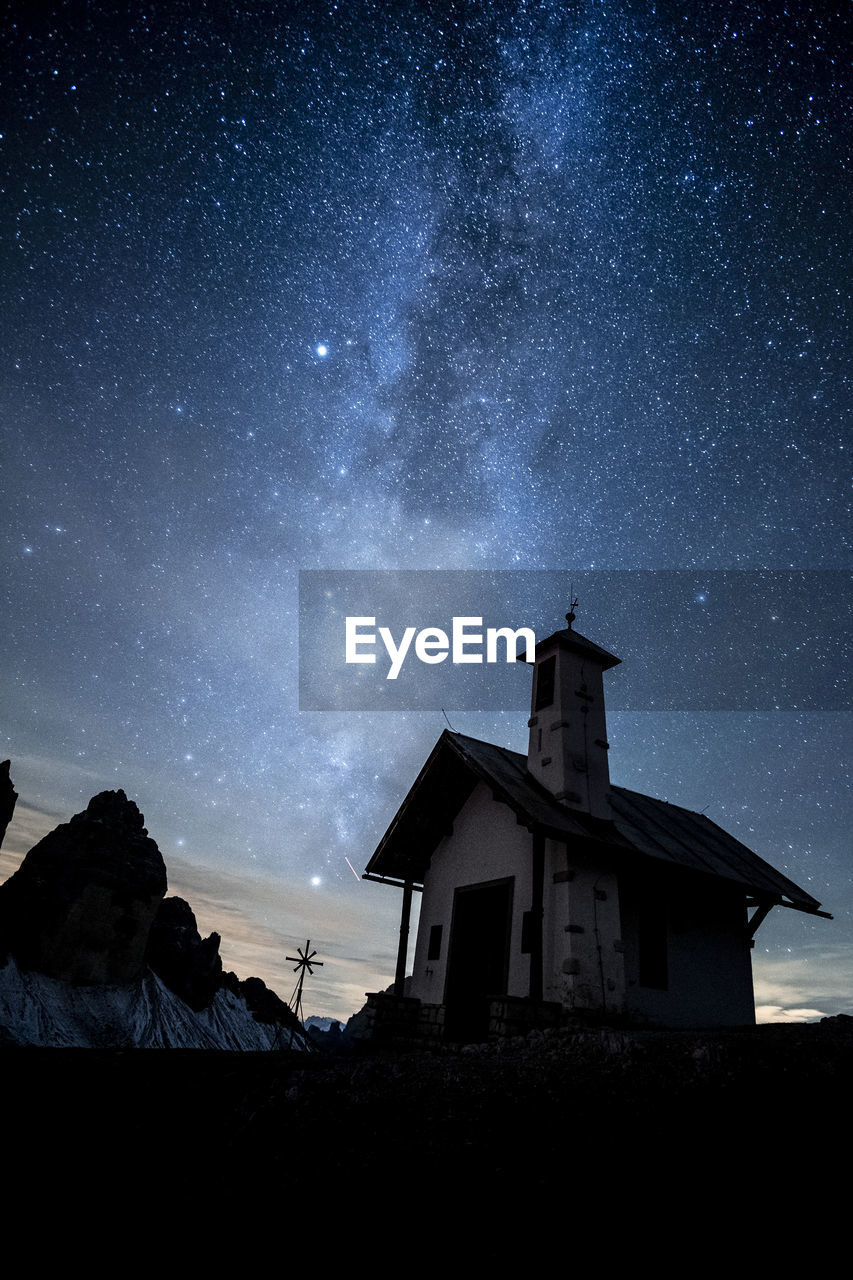 Low angle view of building against sky at night