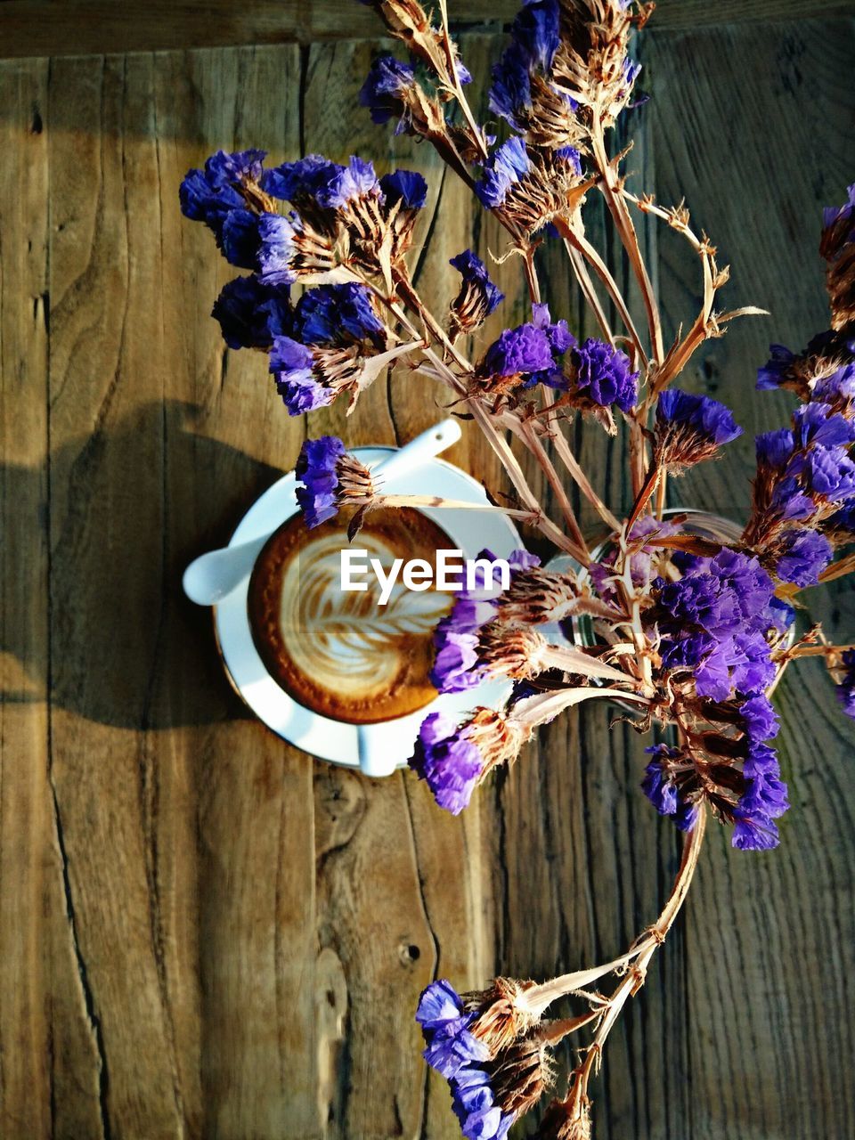 PURPLE FLOWERS ON TABLE