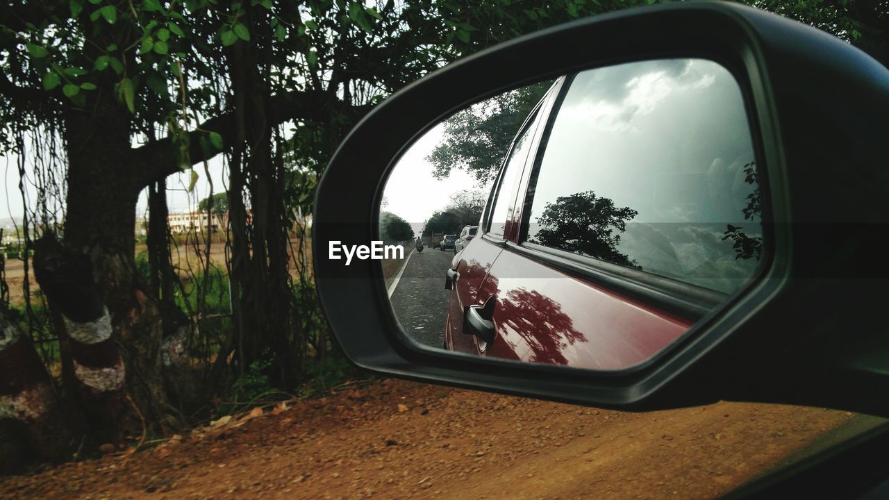 Reflection of car in rear view mirror