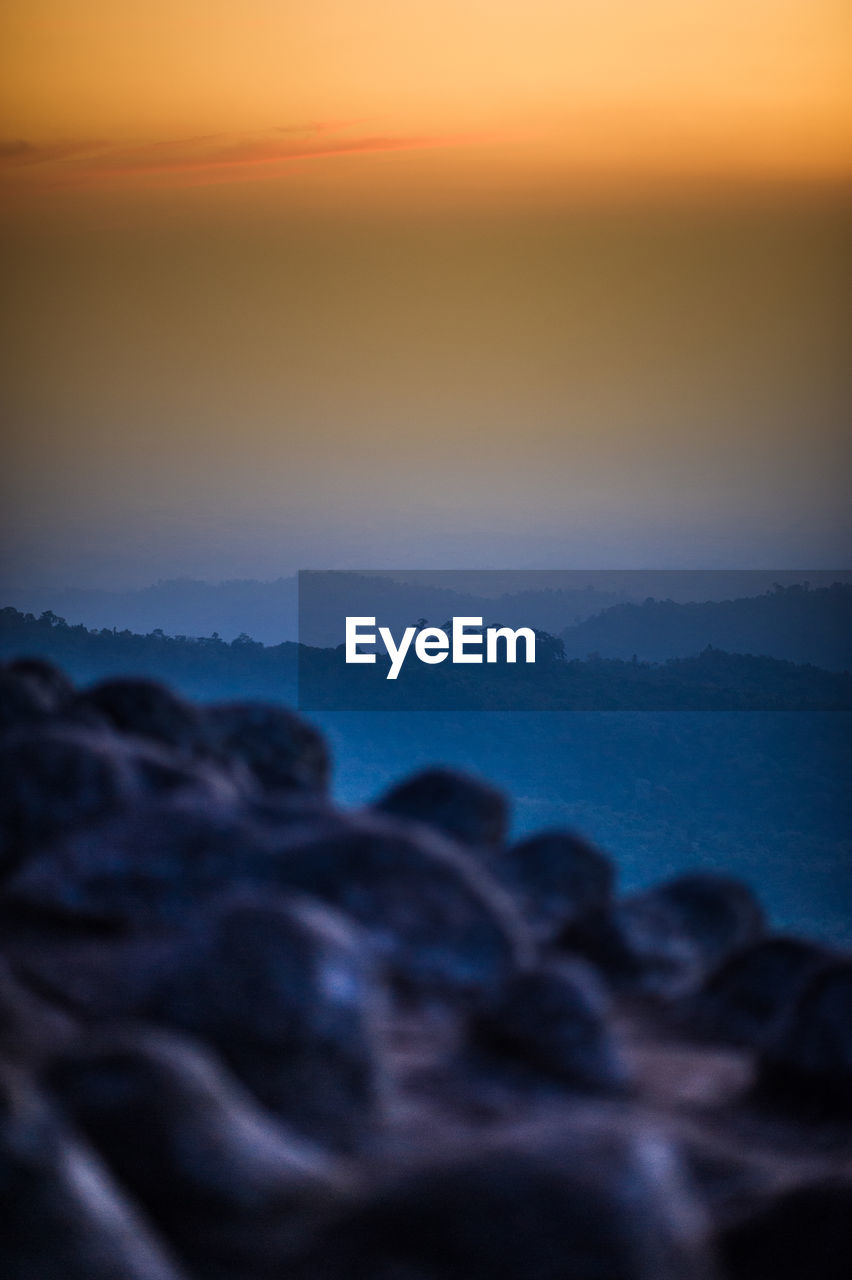 Close-up of sea against sky during sunset