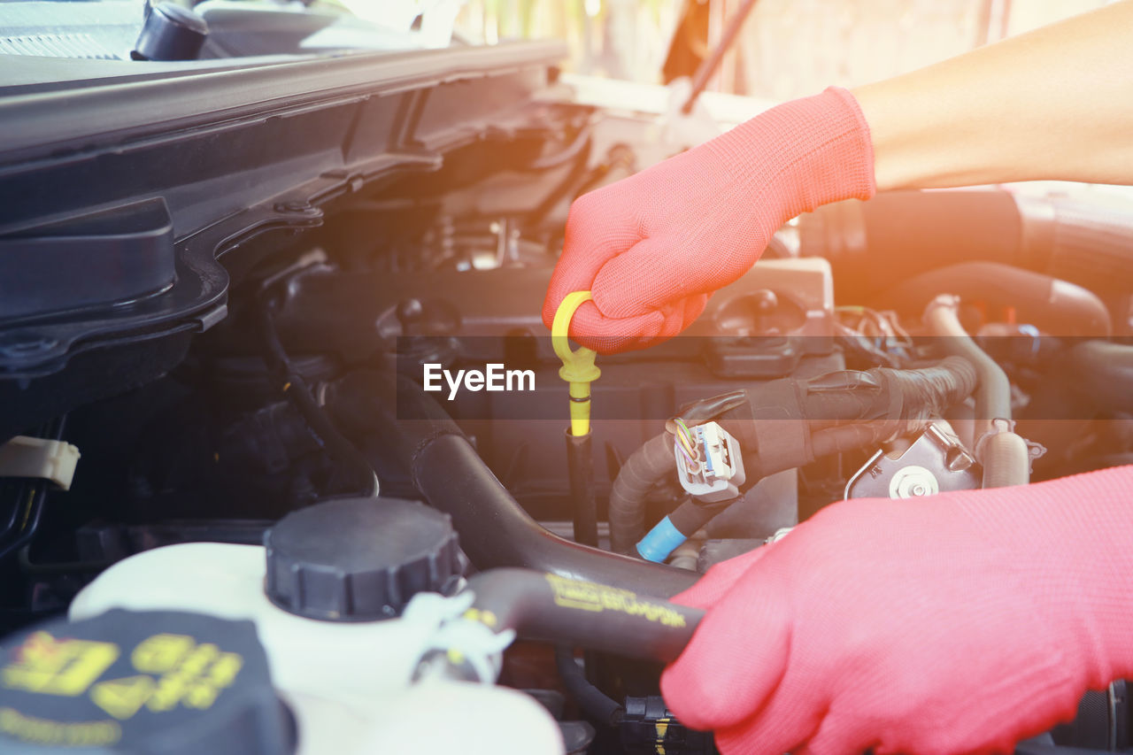 Close-up of mechanic working on car