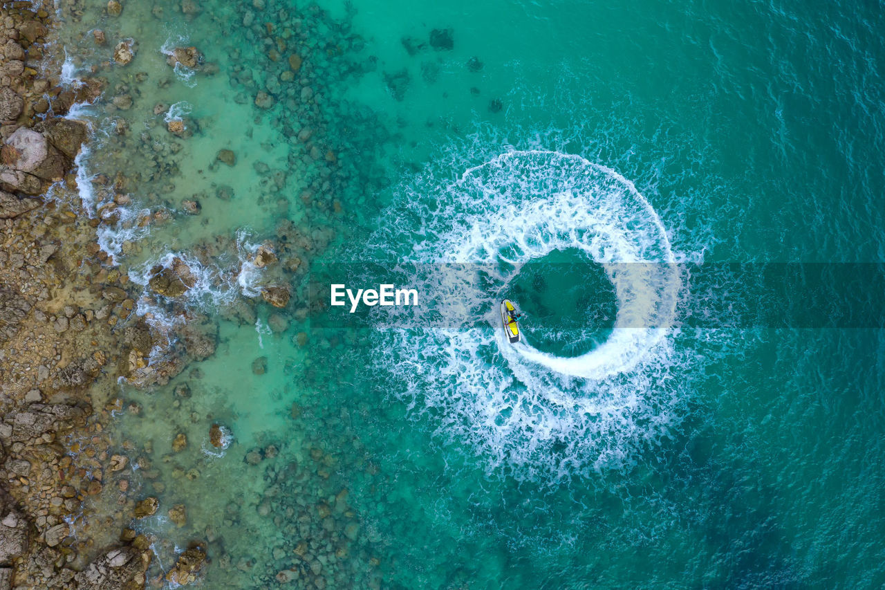 People are playing a jet ski in the sea.aerial view.