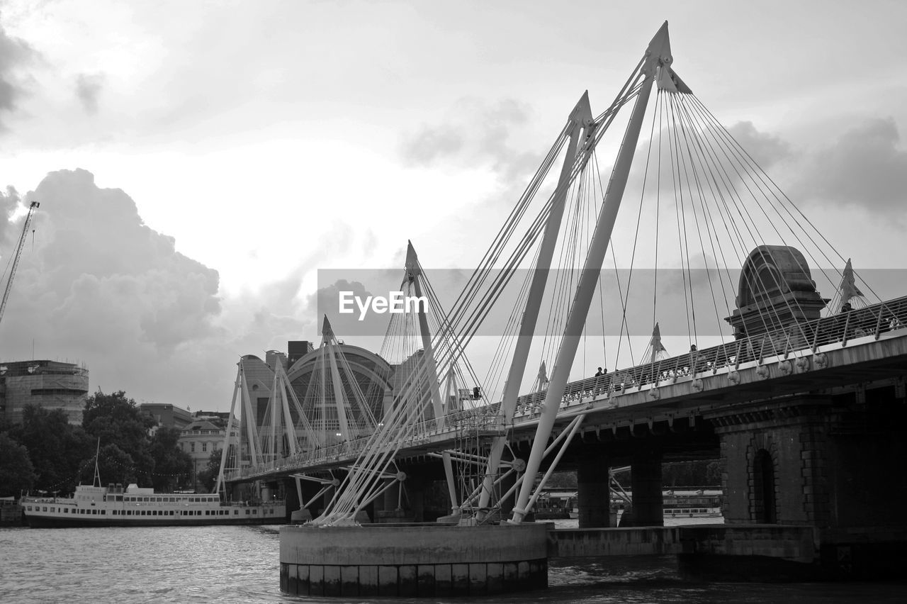 Low angle view of eiffel tower against cloudy sky