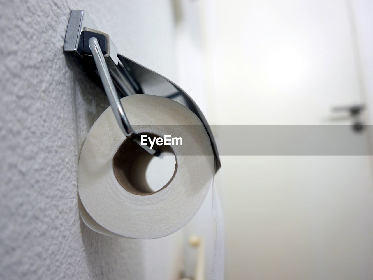 Low angle view of toilet paper roll on holder