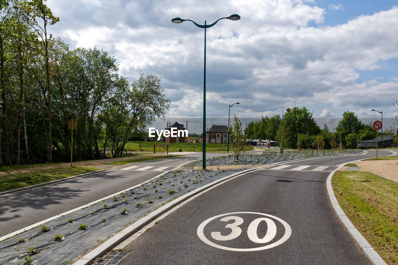 VIEW OF STREET AGAINST SKY