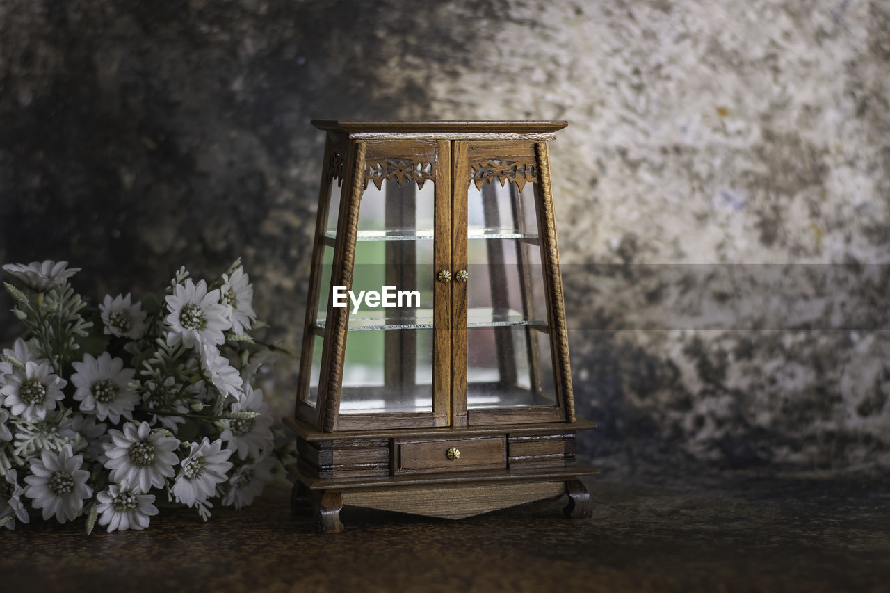 Antique wooden cabinet with mirror and drawers