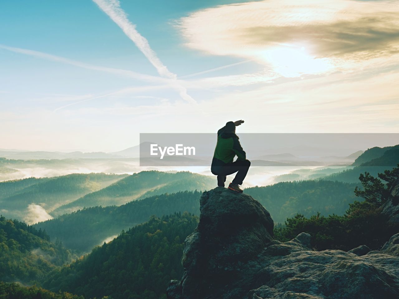 FULL LENGTH OF MAN STANDING ON MOUNTAIN