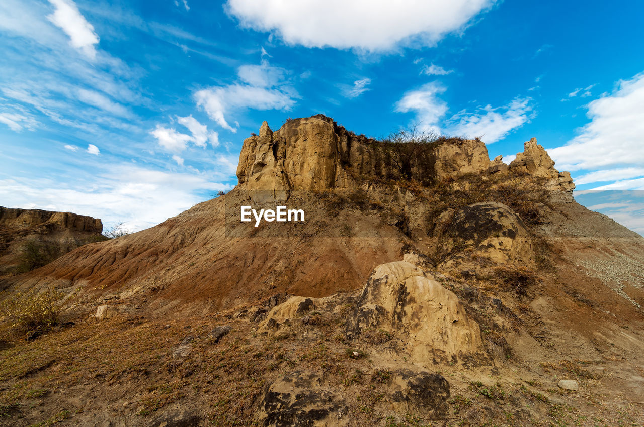 Low angle view of cliff against sky at tatacoa desert