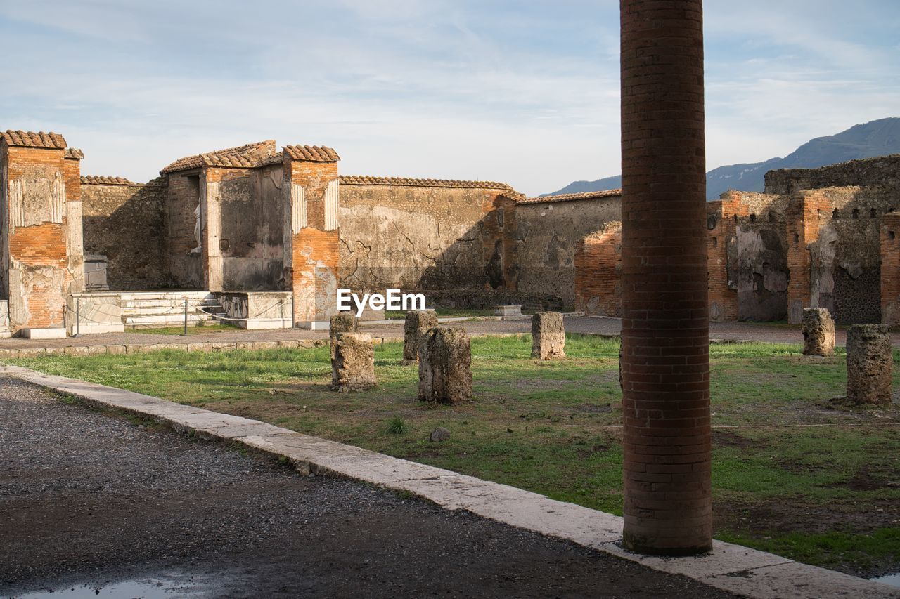 OLD RUINS IN FRONT OF CASTLE AGAINST SKY