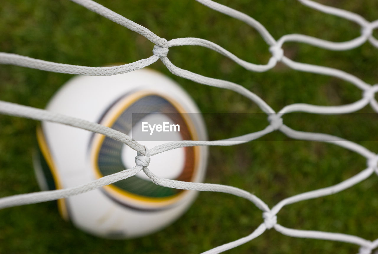 CLOSE-UP OF FENCE ON FIELD