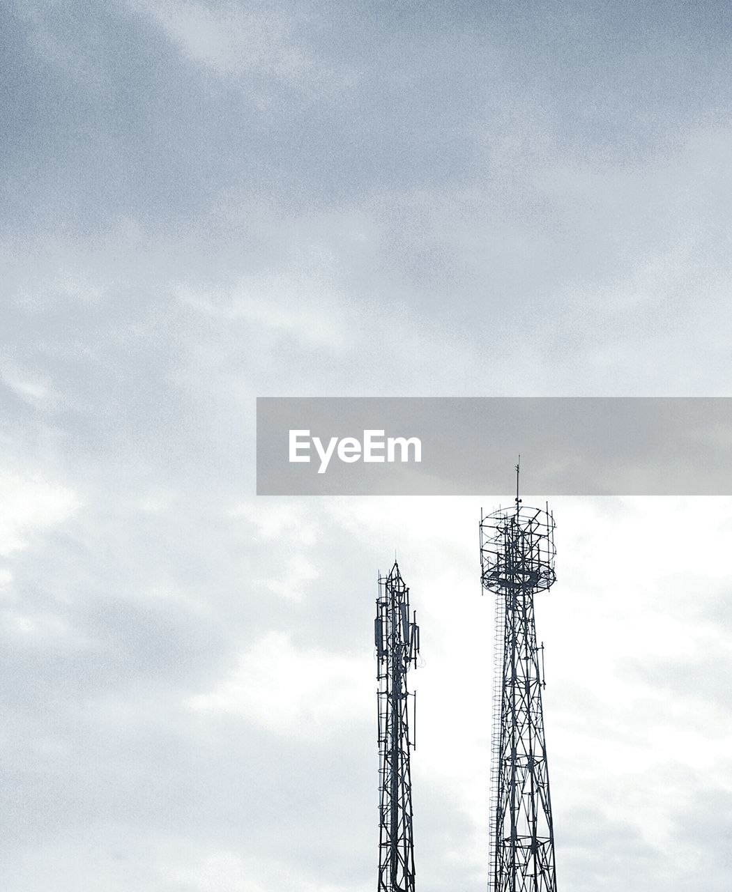 Low angle view of repeater tower against sky