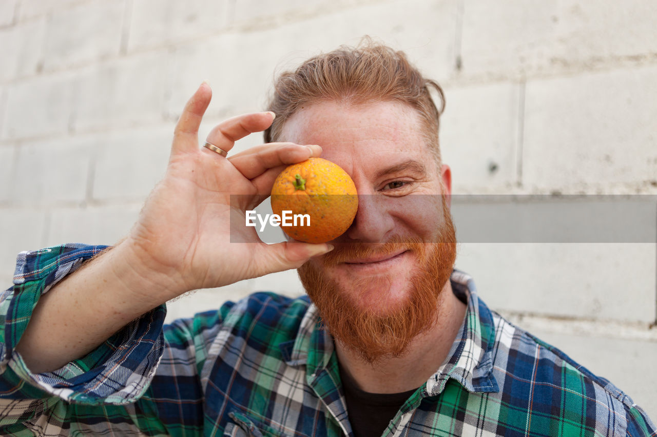 Portrait of man holding ice cream