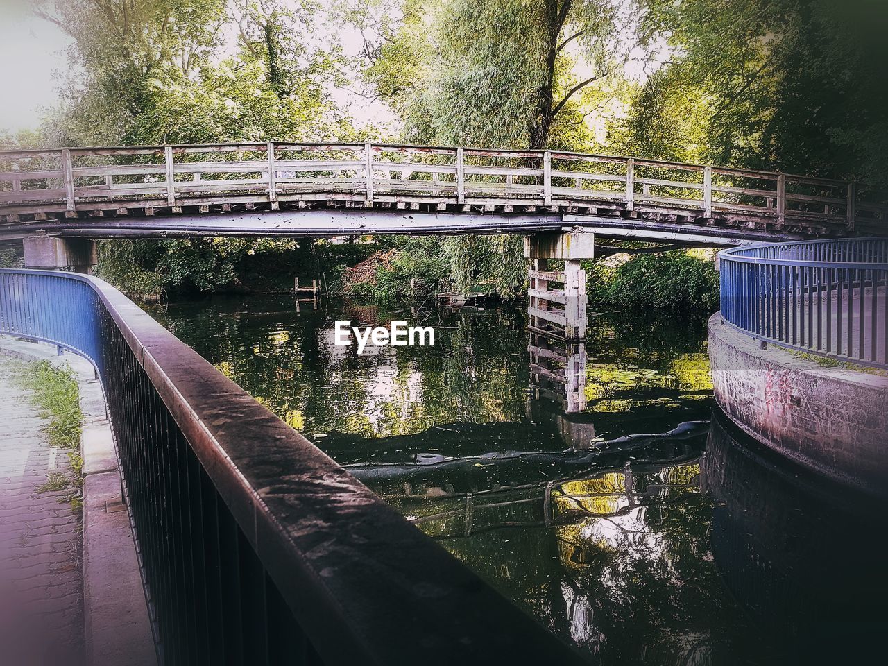 bridge - man made structure, connection, engineering, architecture, river, built structure, transportation, railing, water, footbridge, day, bridge, tree, rail transportation, no people, outdoors, nature