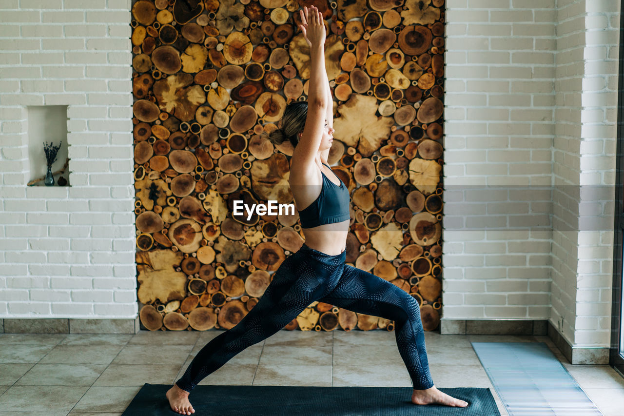 Young woman exercising at home