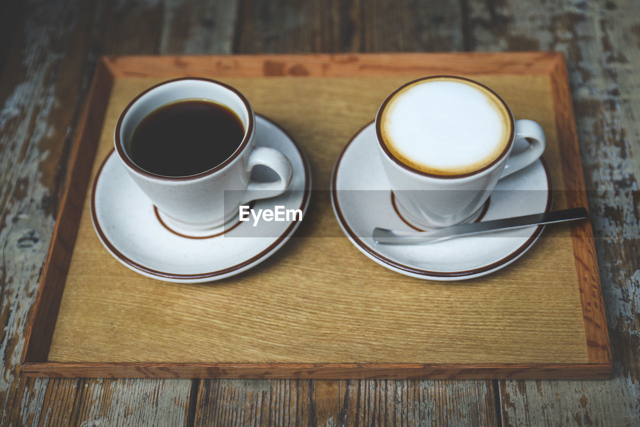 High angle view of coffee cups on table