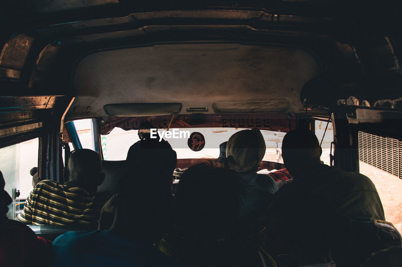 Rear view of people sitting in bus