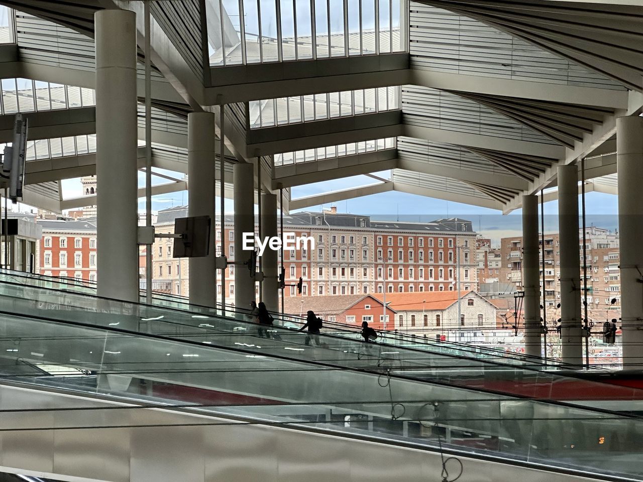 architecture, built structure, city, building exterior, transportation, public transport, travel, railing, day, city life, outdoors, building, glass, transport, bridge, facade, railroad station, travel destinations, mode of transportation, rail transportation, adult, business finance and industry