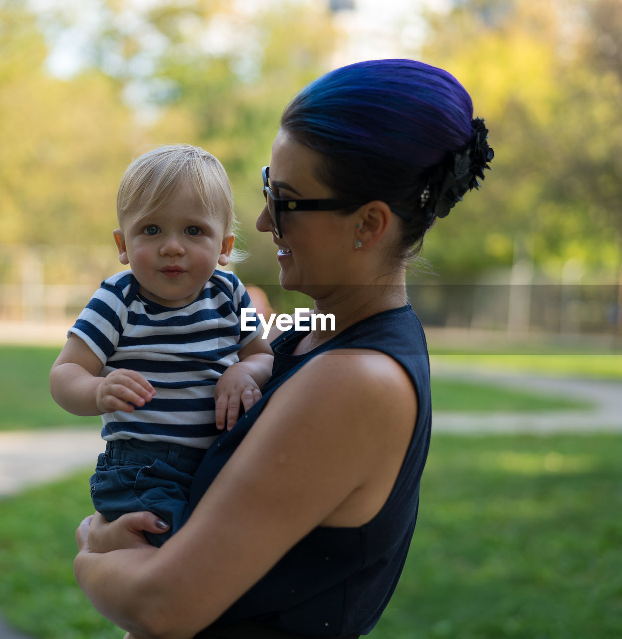 Portrait aunt and son standing outdoors