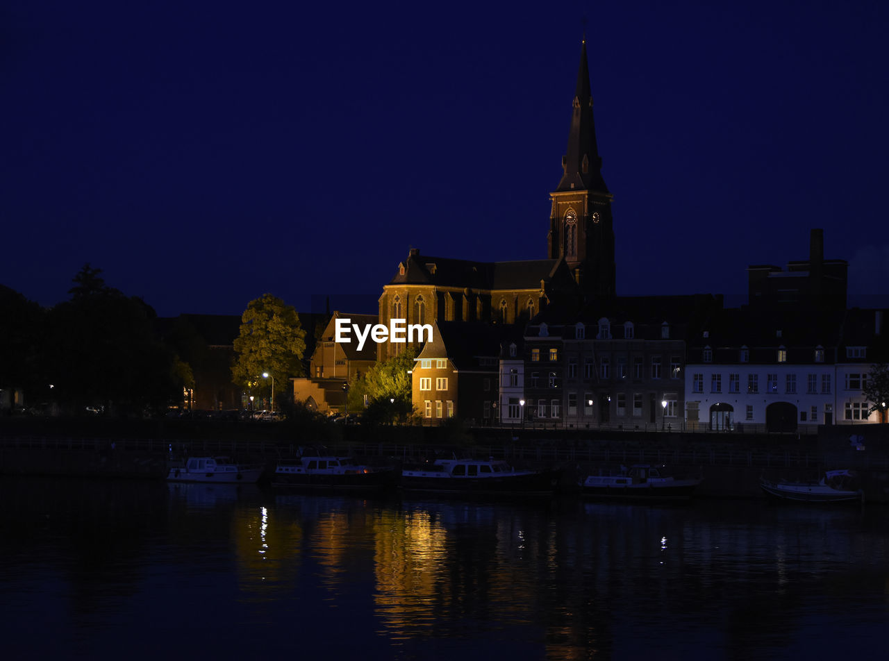 Illuminated buildings at waterfront