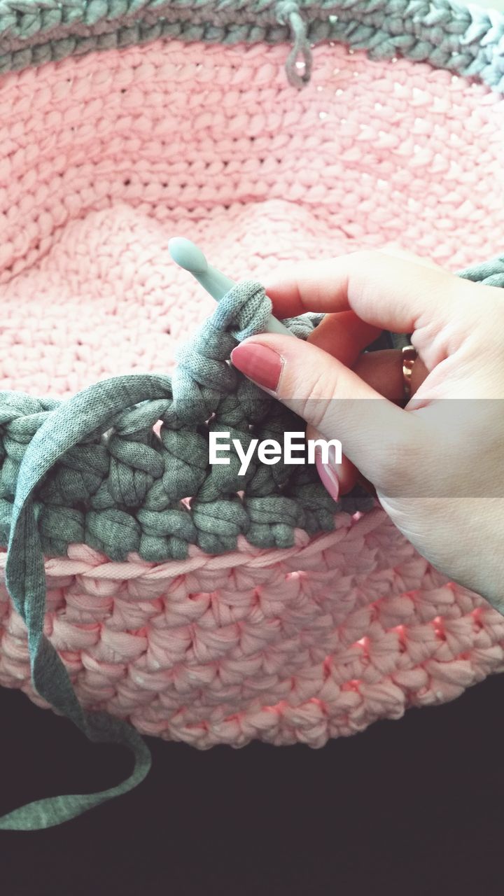Cropped image of hand knitting