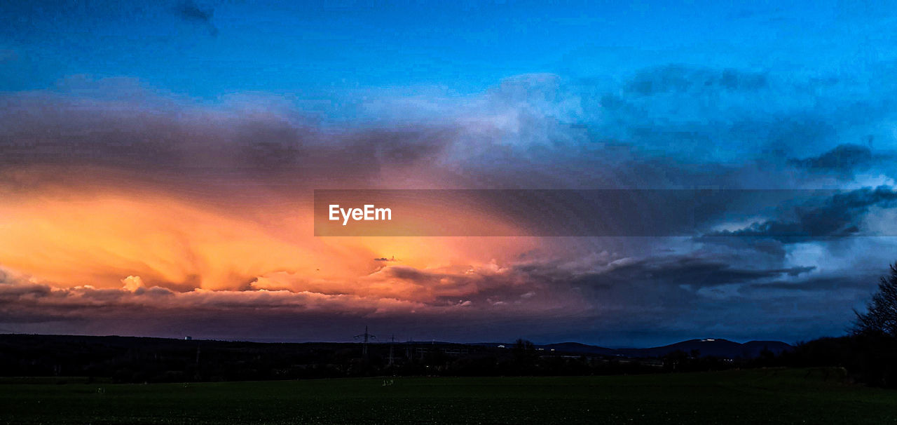 SCENIC VIEW OF DRAMATIC SKY OVER LANDSCAPE