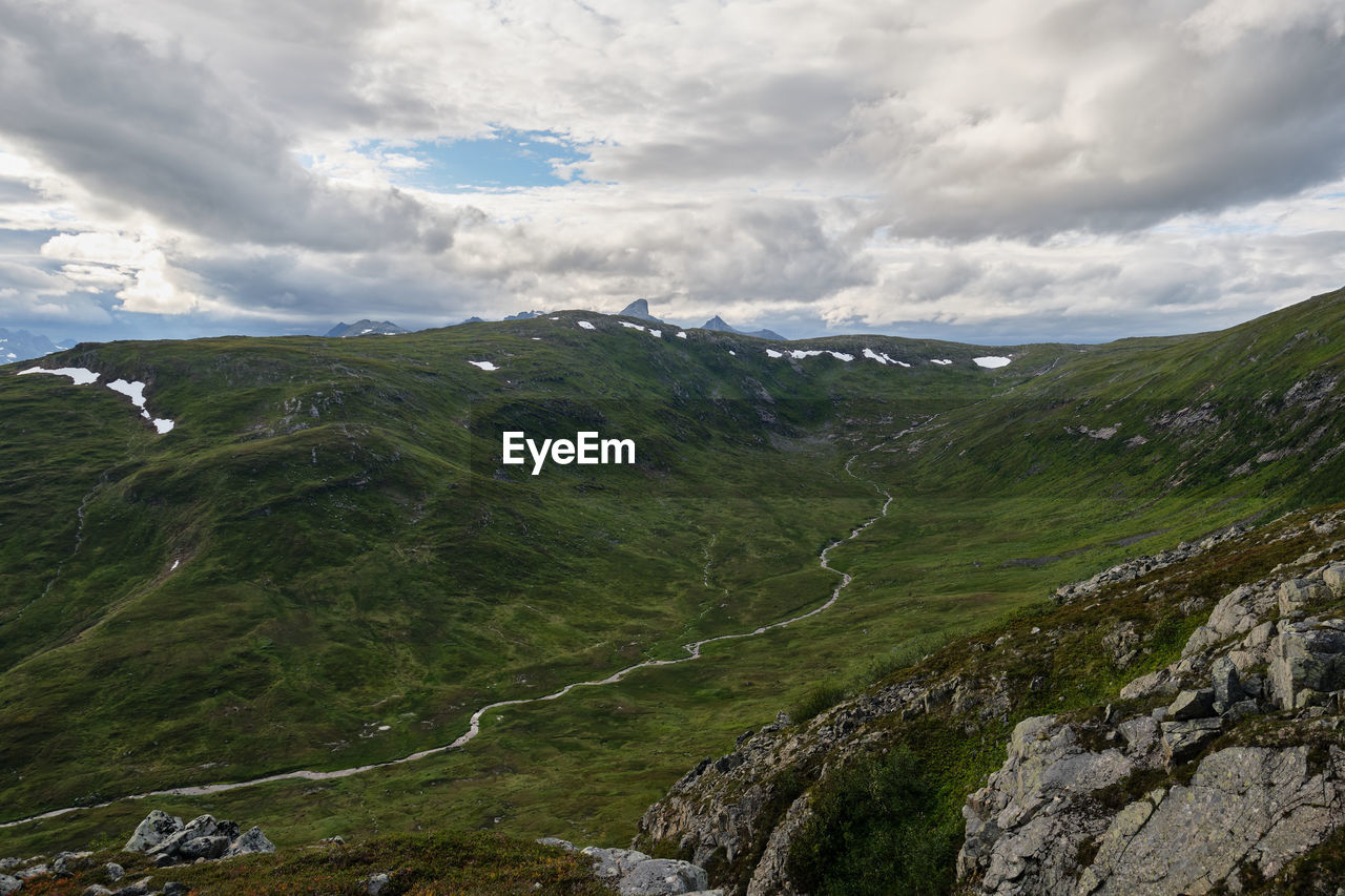 SCENIC VIEW OF VALLEY AGAINST SKY