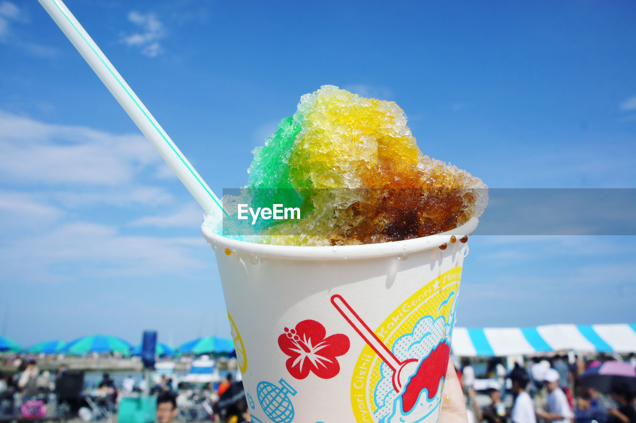 CLOSE-UP OF ICE CREAM IN BLUE SKY