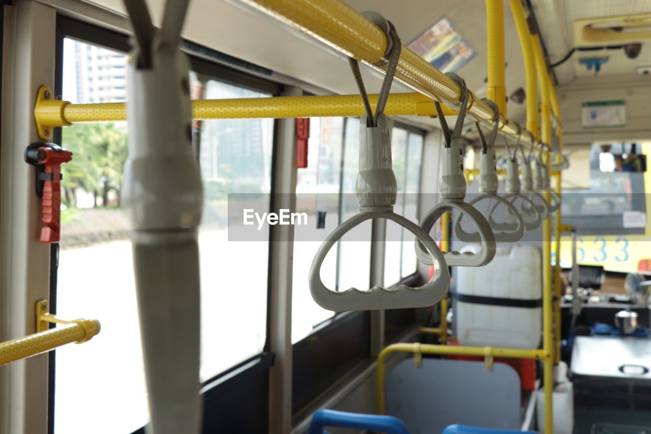 Handles hanging in bus