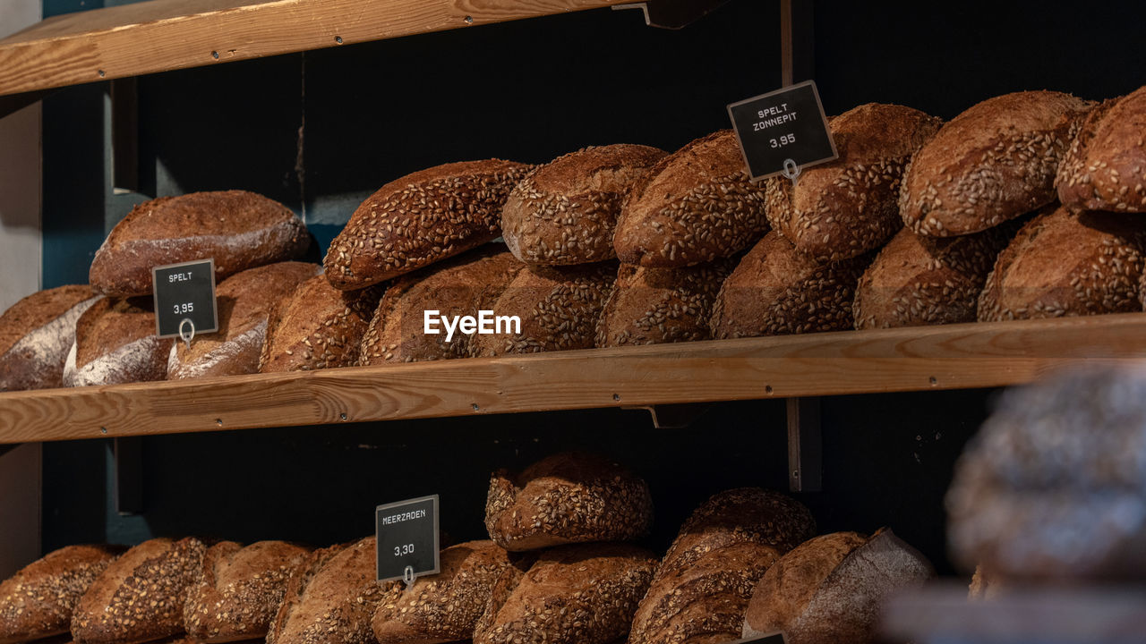 Close-up of croissants and bakery for sale at store