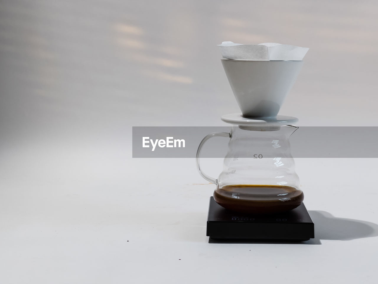 CLOSE-UP OF COFFEE ON GLASS