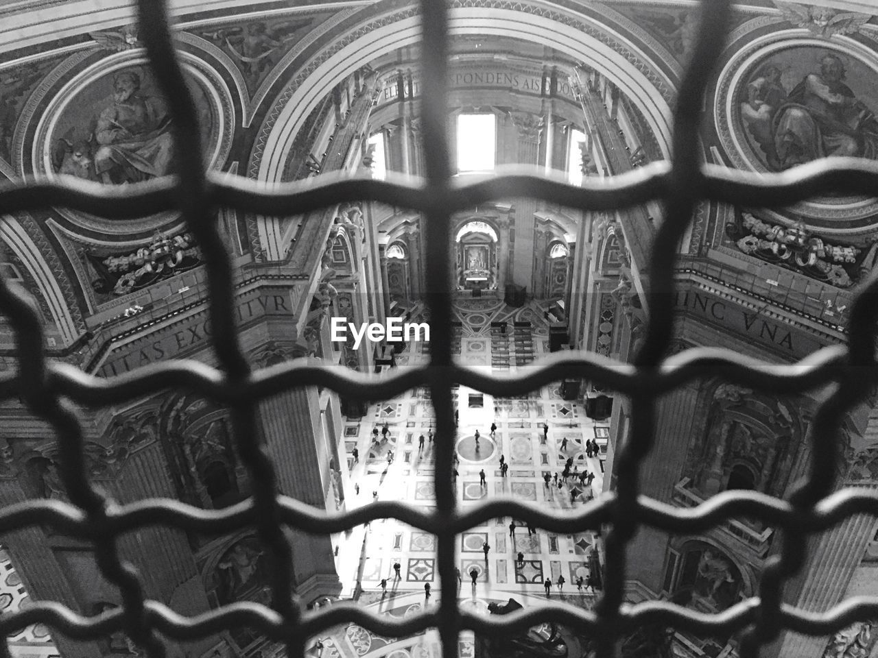 High angle view of people in building seen through window