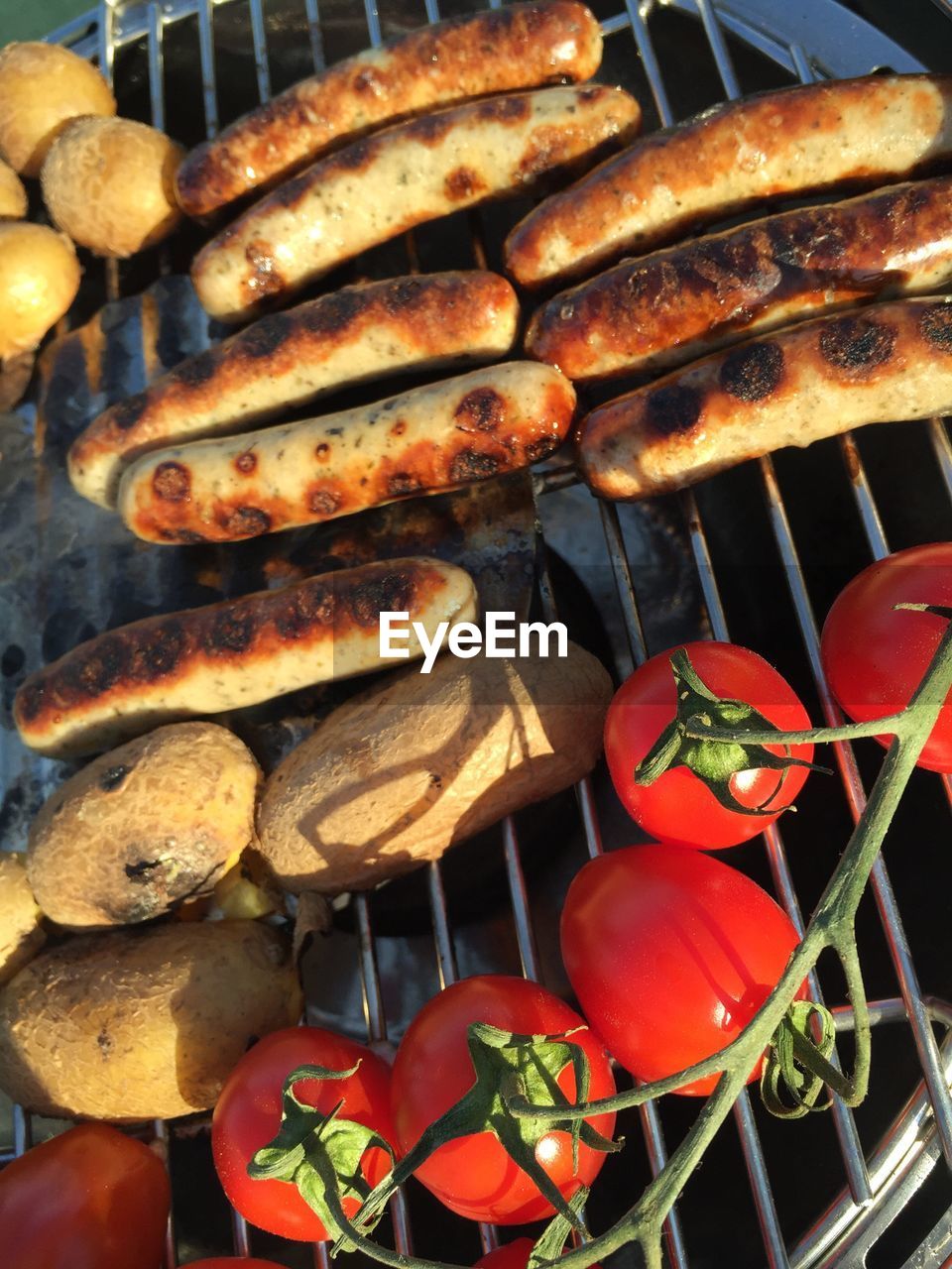 FULL FRAME SHOT OF SAUSAGES ON BARBECUE